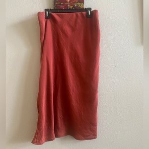 Satin midi skirt in burnt orange.